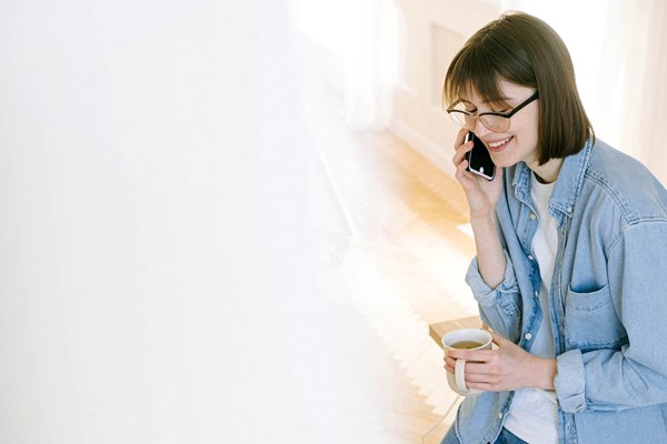 Woman on phone smiling2.jpeg